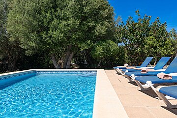 A swimming pool with a greek key design on the edge