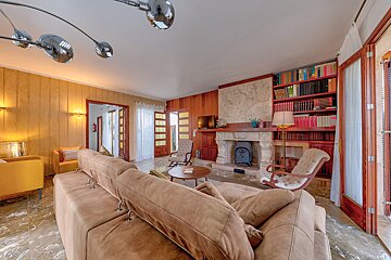 A living room filled with furniture and a fireplace