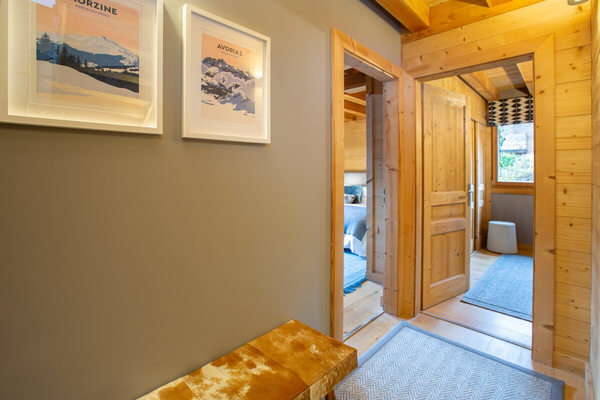 A hallway with a poster on the wall that says aurzine