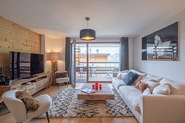 A living room with a couch and a television