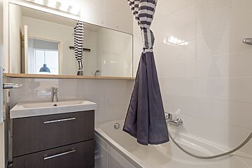 A bathroom with a sink and a bathtub