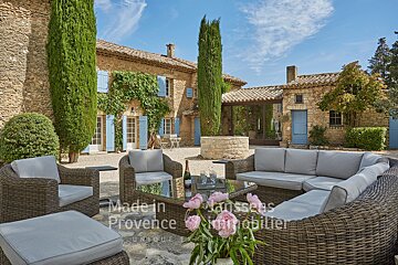 A patio with a couch and chairs made in provence