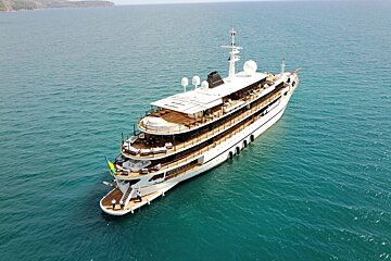 An aerial view of a large yacht in the ocean