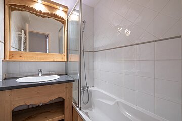 A bathroom with a sink and a bathtub