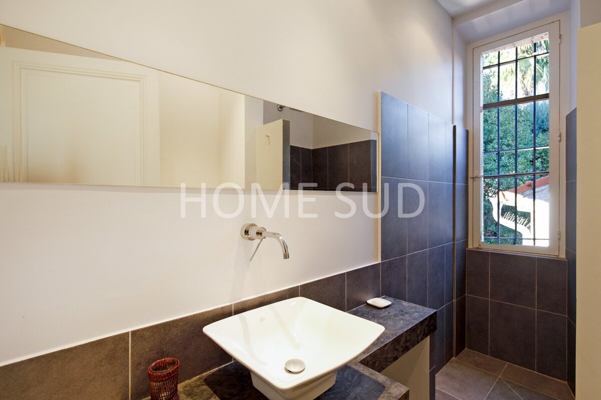 A bathroom with a sink and a mirror that says home sud
