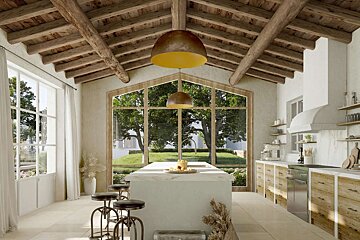 A spacious, bright Mediterranean kitchen with exposed wooden beams, large windows, a central island, and natural wood cabinetry.