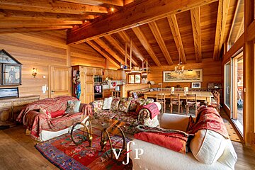 A living room with a couch that has the letter v on it