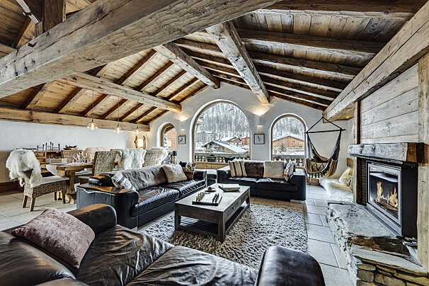 A living room with a fireplace and a couch