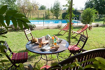 A table with a bottle of orange juice on it