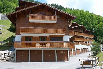 A building with a lot of garages and balconies