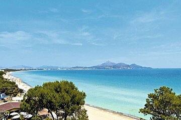 A large body of water with mountains in the background