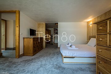 A bedroom with the number 80 on the wall