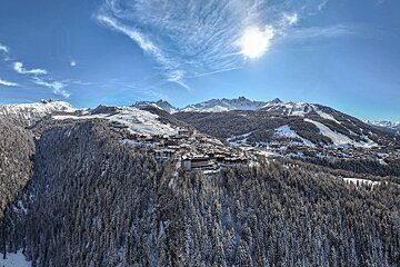 An aerial view of a ski resort in the mountains