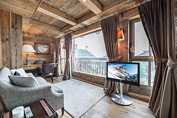 A flat screen tv shows a skier on the screen