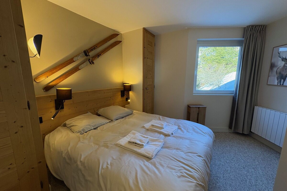 A bunk bed with a ladder leading up to it