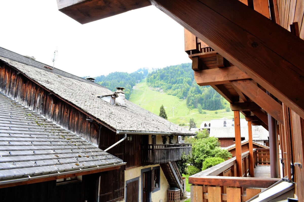 A view of a mountain from the balcony of a building