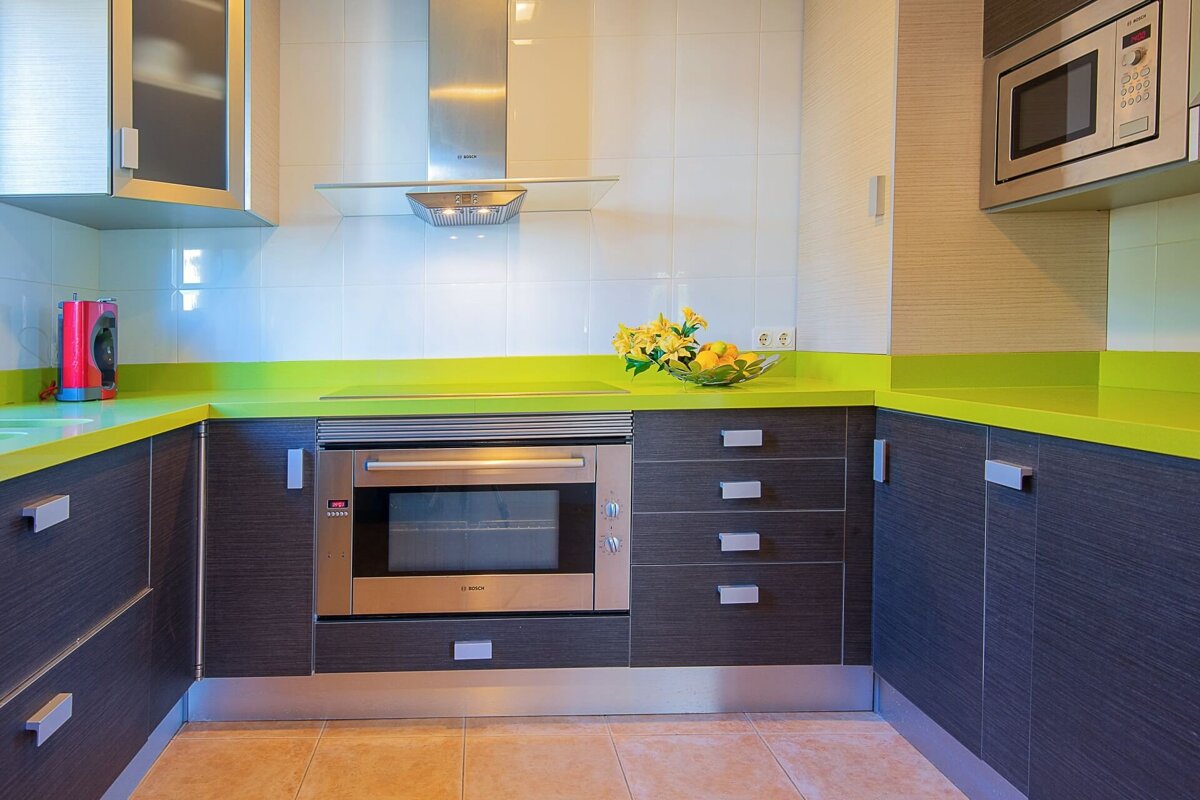 A kitchen with a bosch oven and a microwave