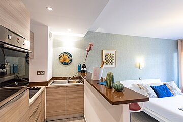 A kitchen with a counter top that says ' cactus ' on it