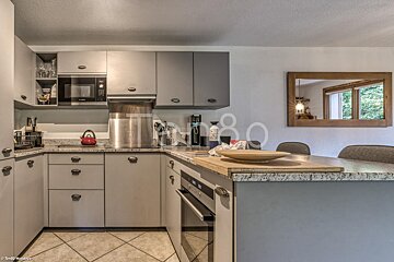 A kitchen with the number 80 on the wall