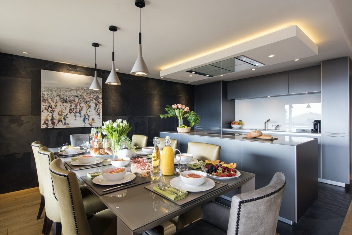 A dining room table with plates of food on it