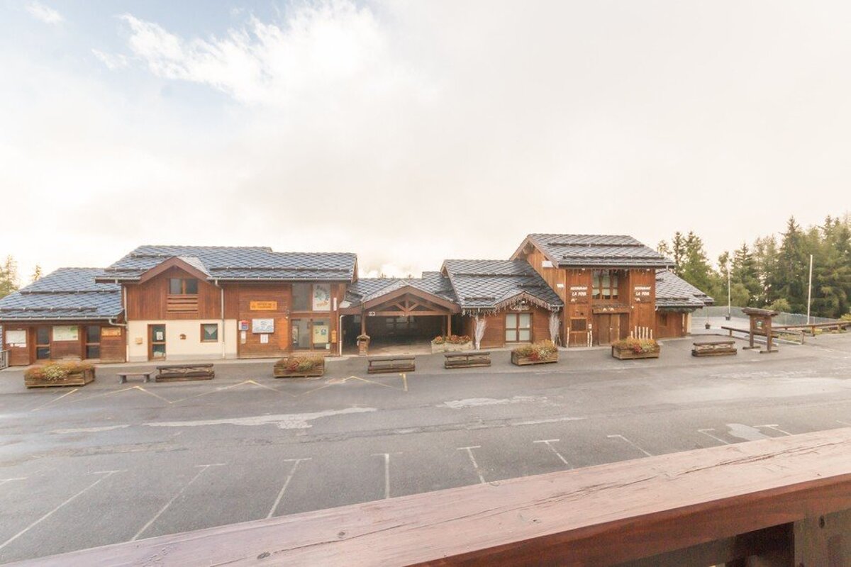 A large building with a sign that says ' tourisme ' on it