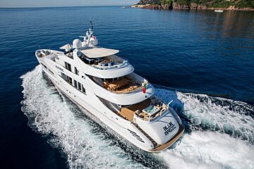 A large white yacht with the word blue on the back