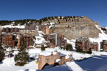 A snowy mountain with a lot of buildings on it