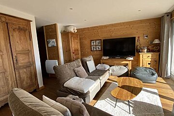 A living room with a couch and a flat screen tv