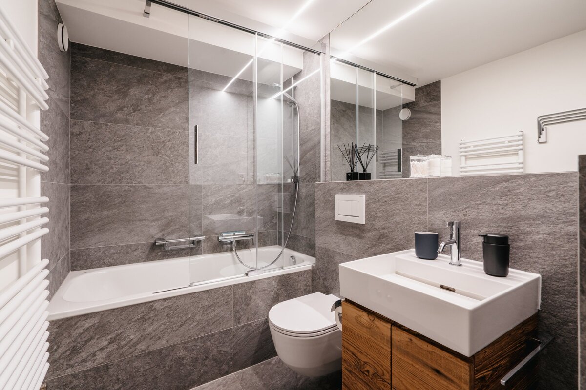 A bathroom with a bathtub toilet and sink
