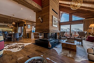 A living room filled with furniture and a fireplace
