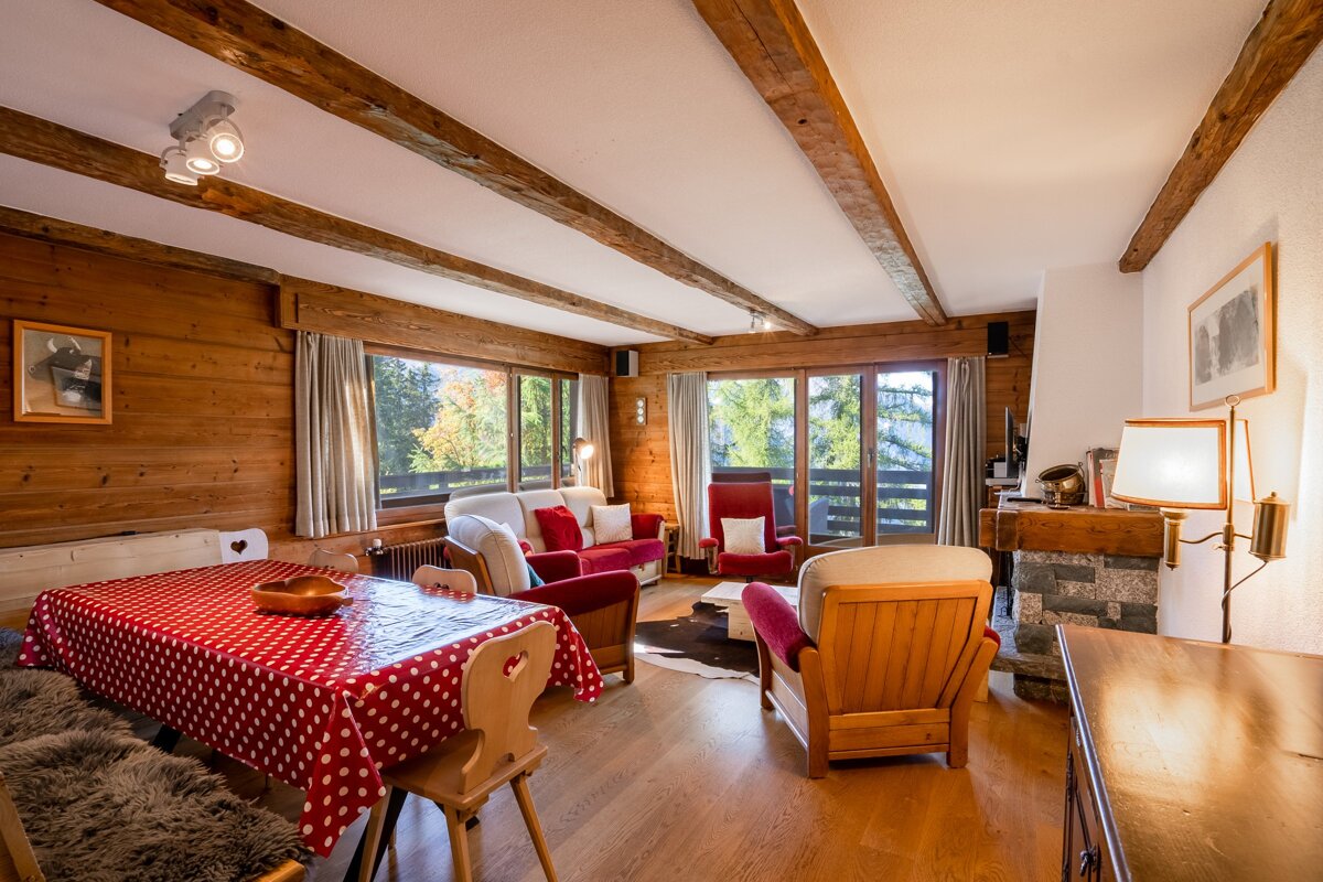 A living room with a red polka dot table cloth