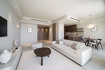 A living room with a couch and a table