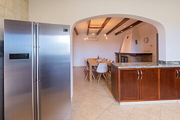 A stainless steel samsung refrigerator sits in a kitchen