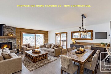 A warm, inviting chalet-style living and dining room with a stone fireplace, rustic wood accents, comfortable furniture, and snowy mountain views.