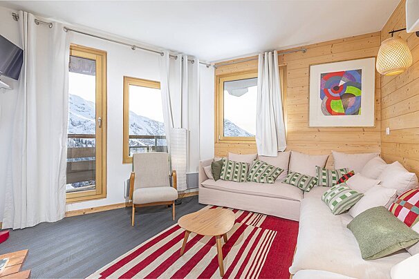 A living room with a couch and a chair
