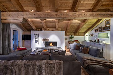 A living room with a fireplace and a couch
