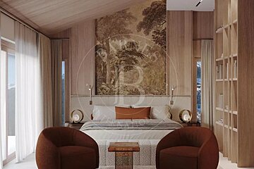 A cozy bedroom with wood-paneled walls, a large forest mural above the bed, two plush armchairs, and snowy mountain views outside.