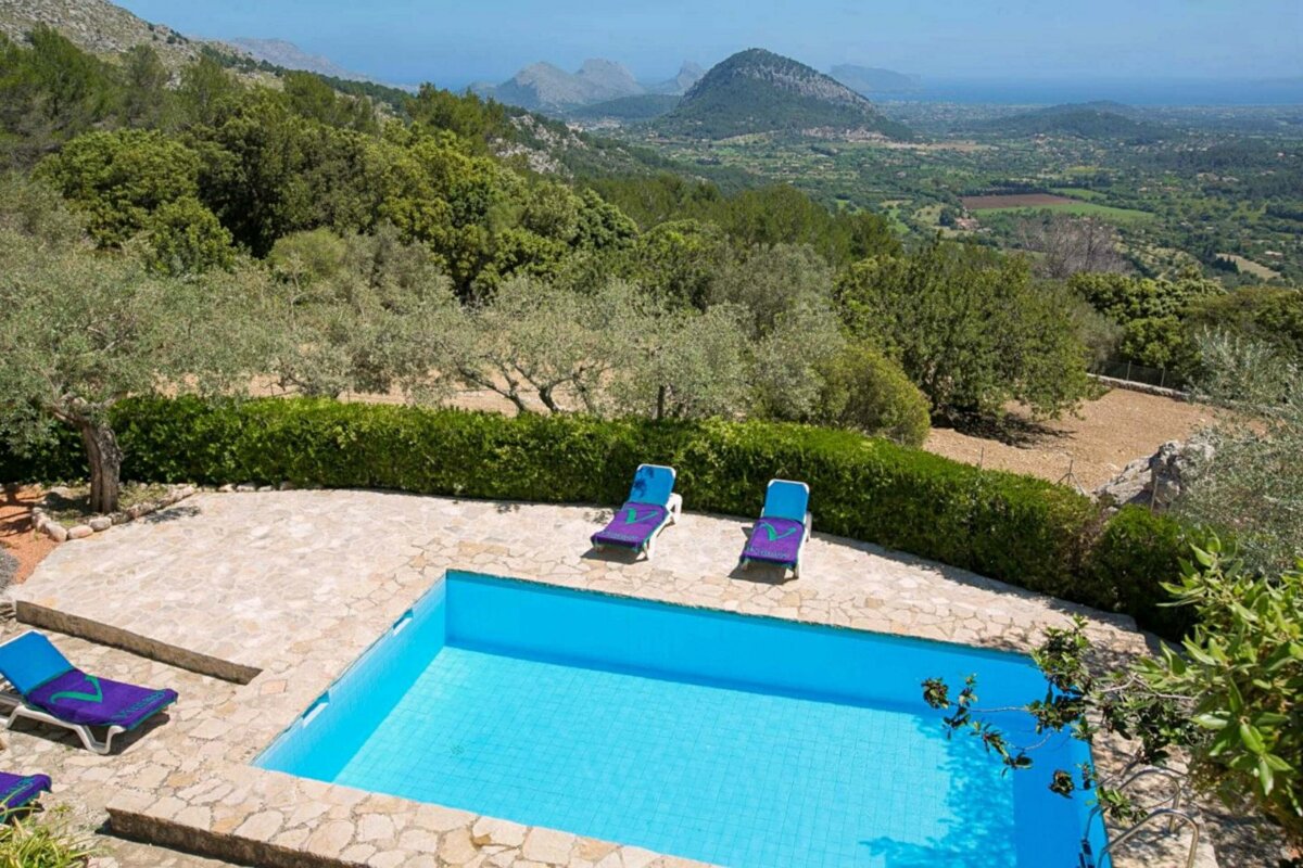 A swimming pool with a view of a valley and mountains