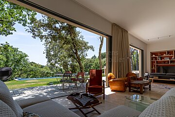 A living room with a sliding glass door leading to a patio
