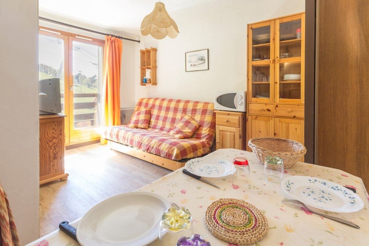 A living room with a couch and a microwave