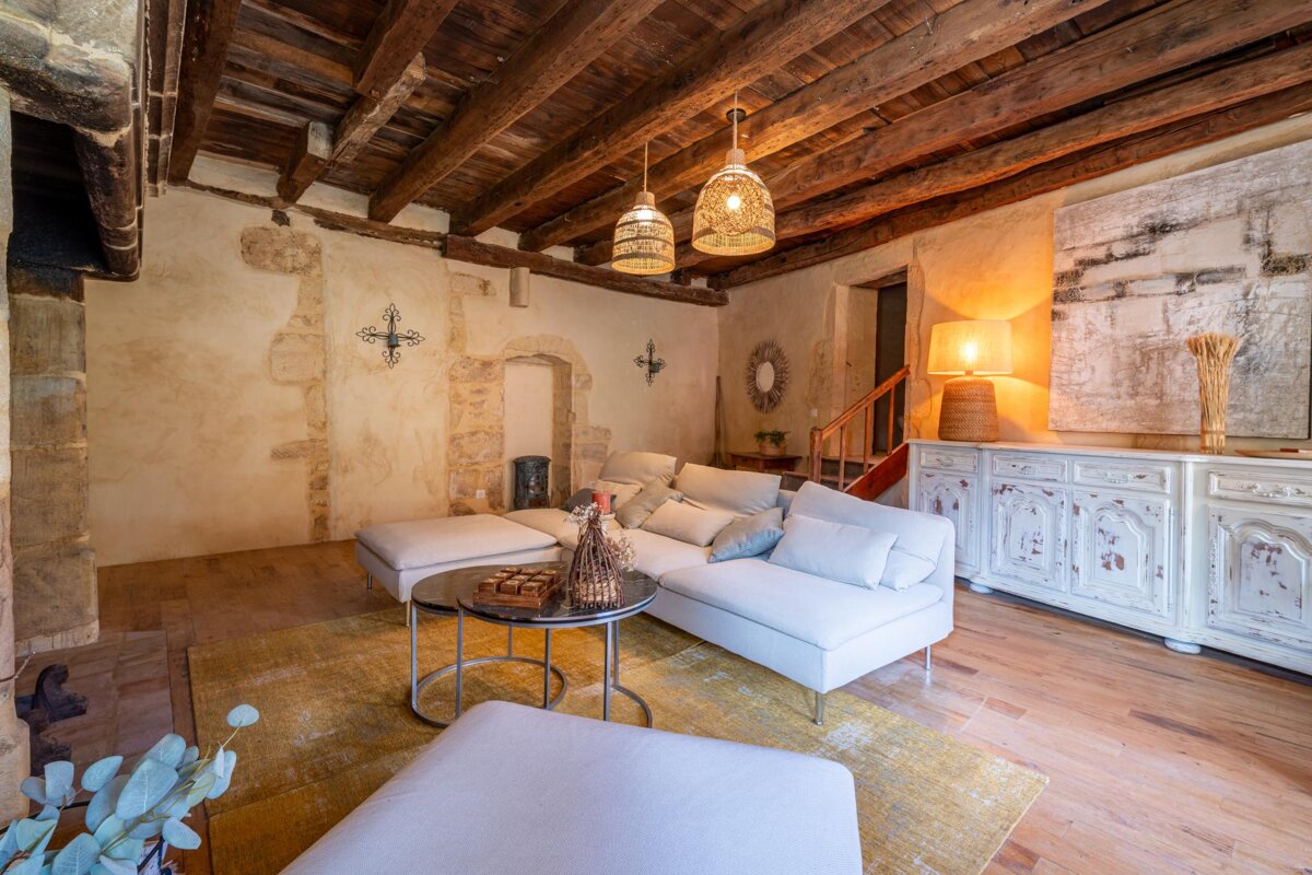 A living room with a couch and two tables