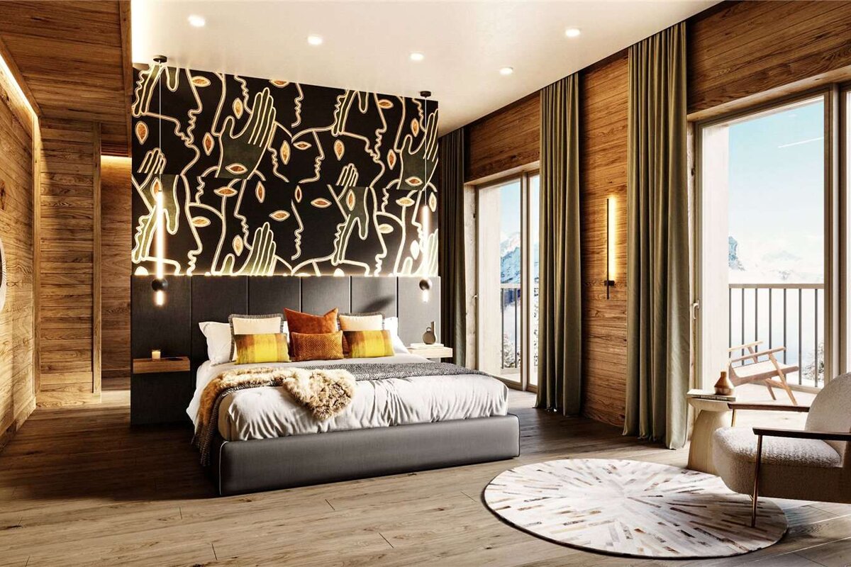 A bedroom with a large bed and a large window