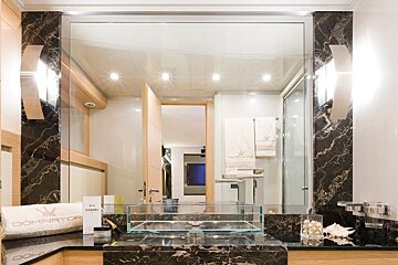 A bathroom with a chanel towel on the counter