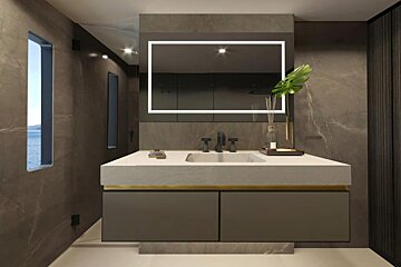 A bathroom with a sink a mirror and a window