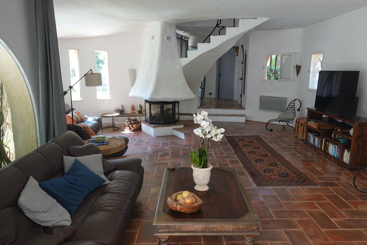 A living room with a couch and a television