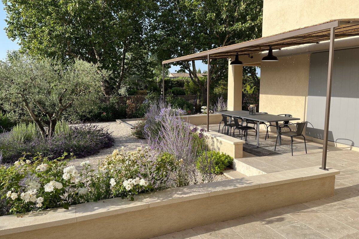 A patio with a table and chairs under a canopy
