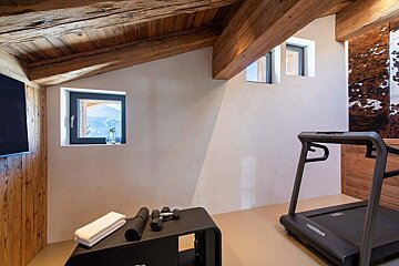 A treadmill in a room with a window