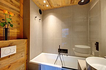 A bathroom with a bathtub and a sink