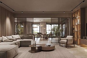 A chic, neutral-toned open-plan living room with a large sofa, coffee tables, and a dining area visible through modern glass partitions.