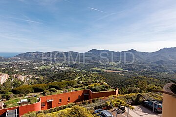 A view of a valley with the words home sud in the foreground